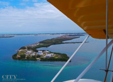 Why Flying High In A Vintage Bi-plane May Be the Best Way to See Key West