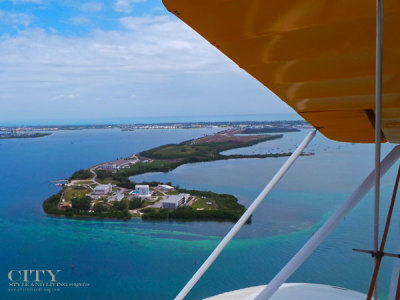 Why Flying High In A Vintage Bi-plane May Be the Best Way to See Key West
