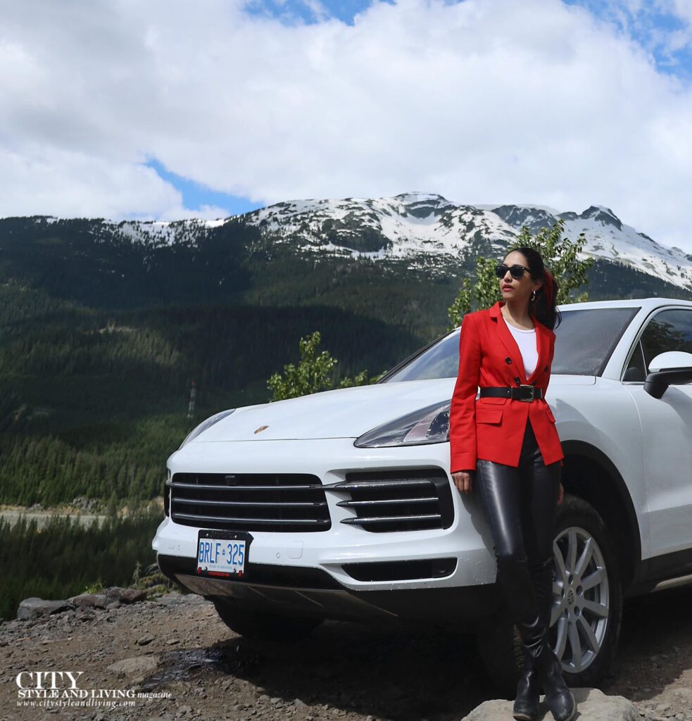 City Style and Living Porsche Off Road Experience Whistler girl standing on mountaintop