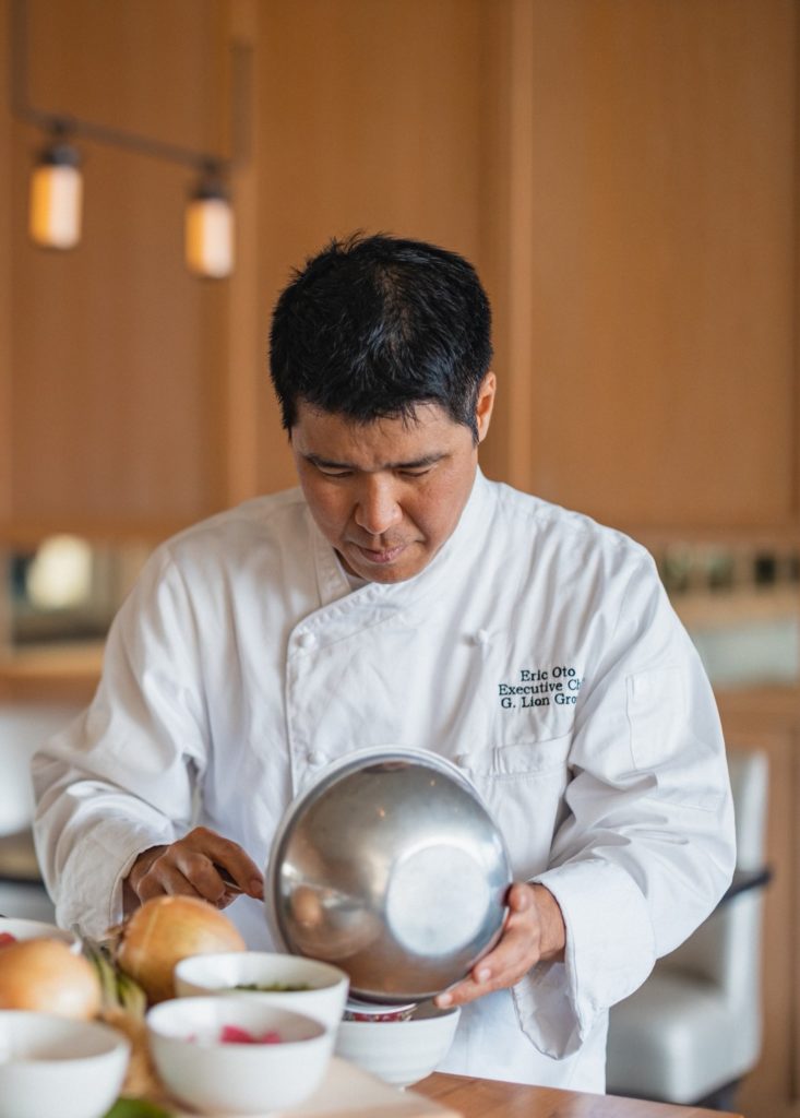 Chef Oto Mixes Poke in a bowl Ritz Carlton Residences Waikiki