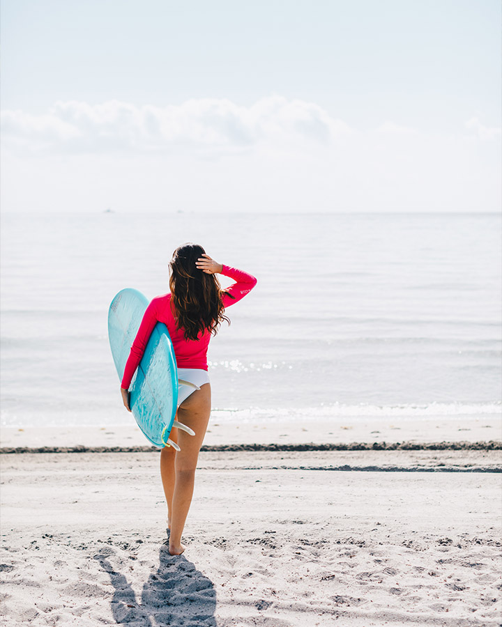 Surfer girl at the beach at The Boca Raton Palm Beach