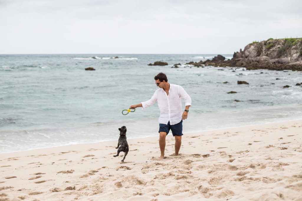 City Style and Living Spring 2023 National Pet Day Four Seasons Punta Mita running with dog on beach
