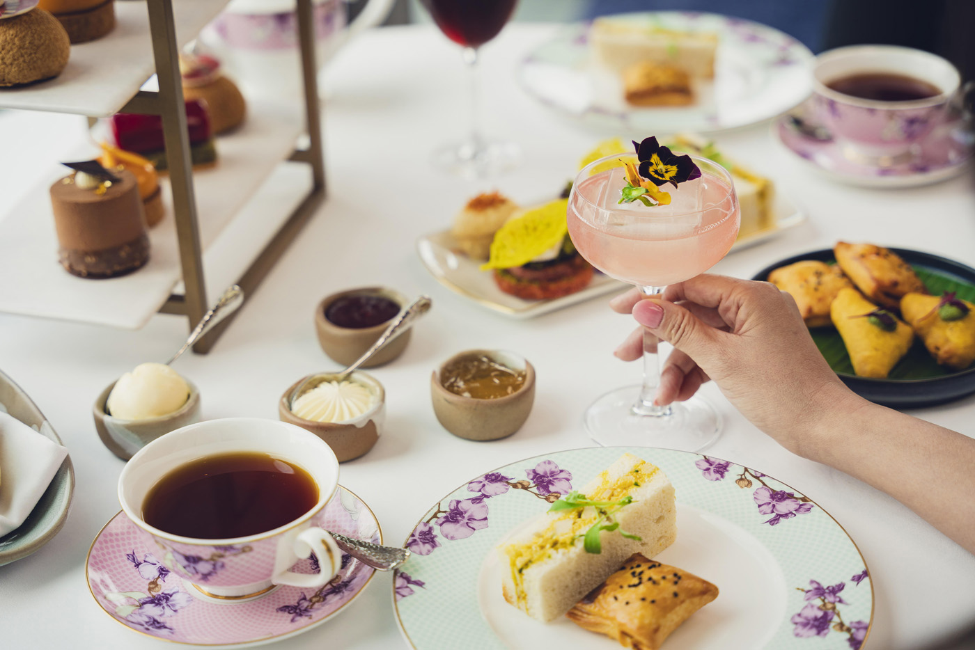 InterContinental London – The O2 Chai By The Shore Afternoon Tea Indian inspired closeup of food full spread and tea cups City Style and Living