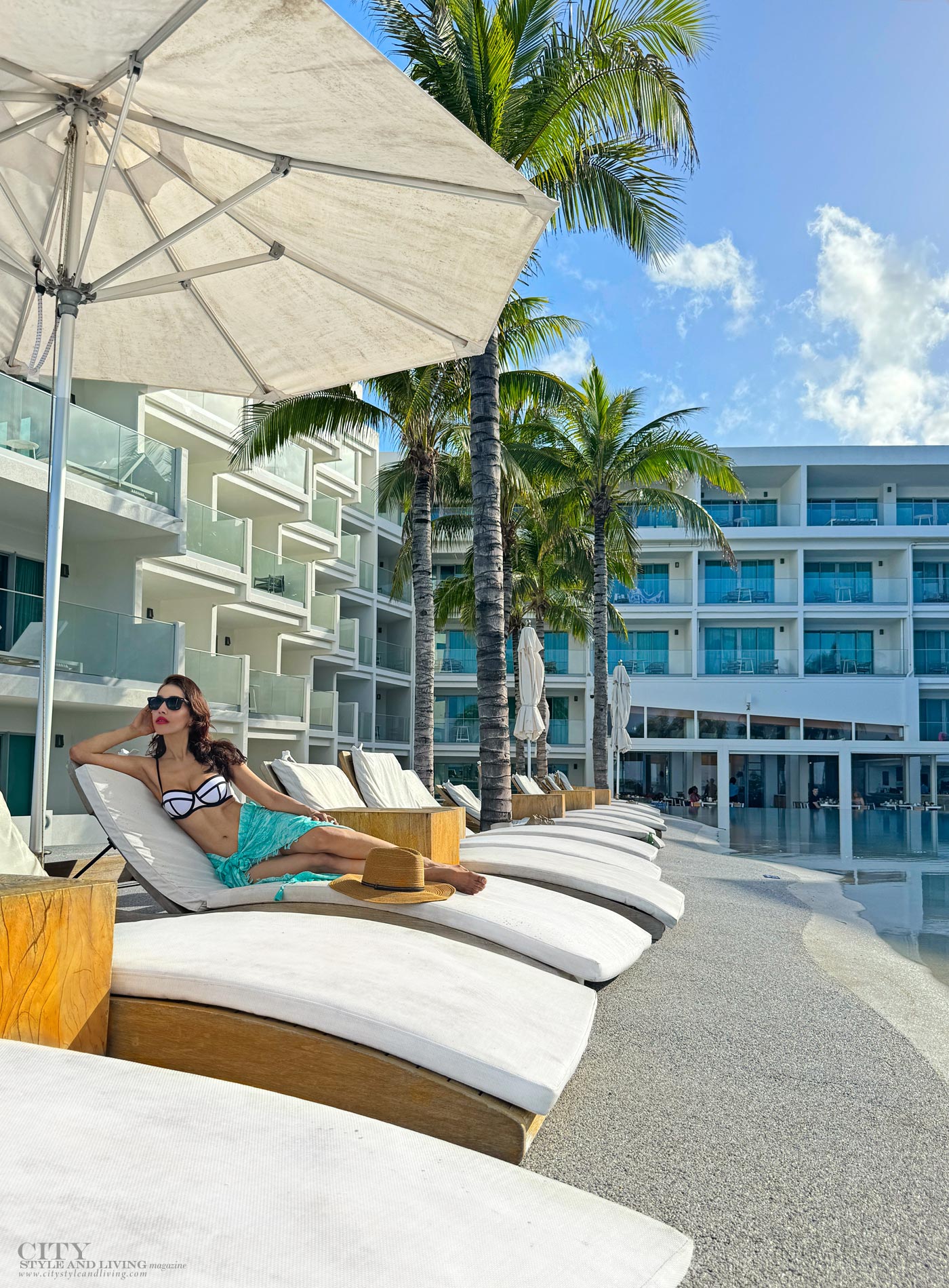 City Style and Living Fall 2024 The Morgan Resort Spa & Village St. Martin Girl laying on lounger by pool