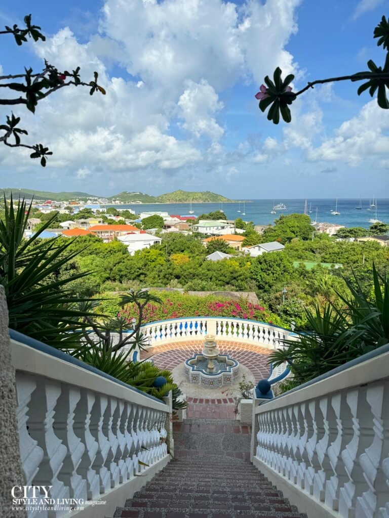 City Style and Living Fall 2024 Hotel L'Esplanade St. Martin Grand staircase overlooking boats in ocean