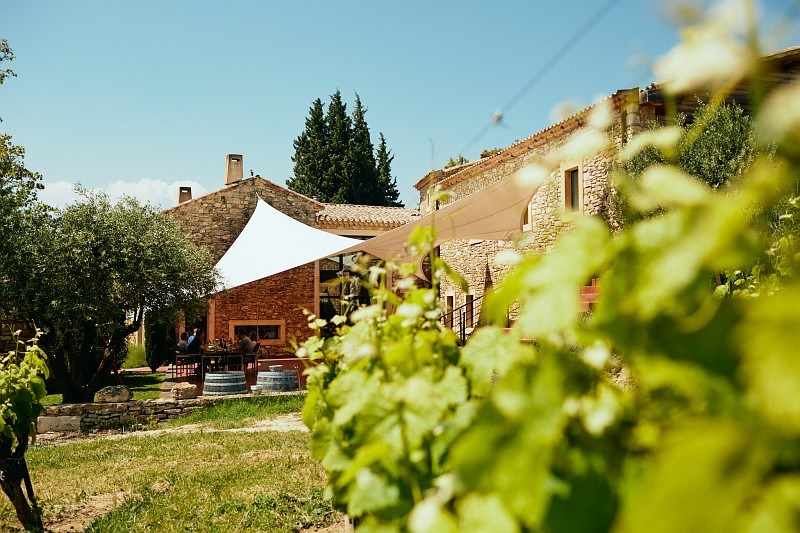 City Style and Living Cotes Du Rhone White Wine Stone building and vineyards
