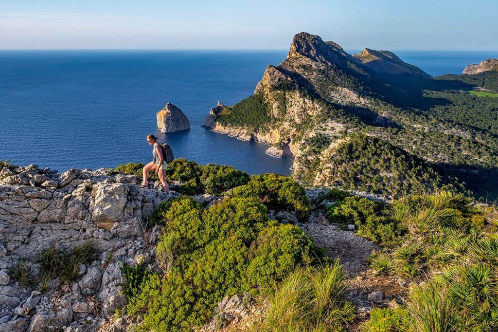 City Style and Living Magazine Summer 2025 7 Global Hikes Worth The Trek formentor-pollenca-majorca-spain-woman-hiker