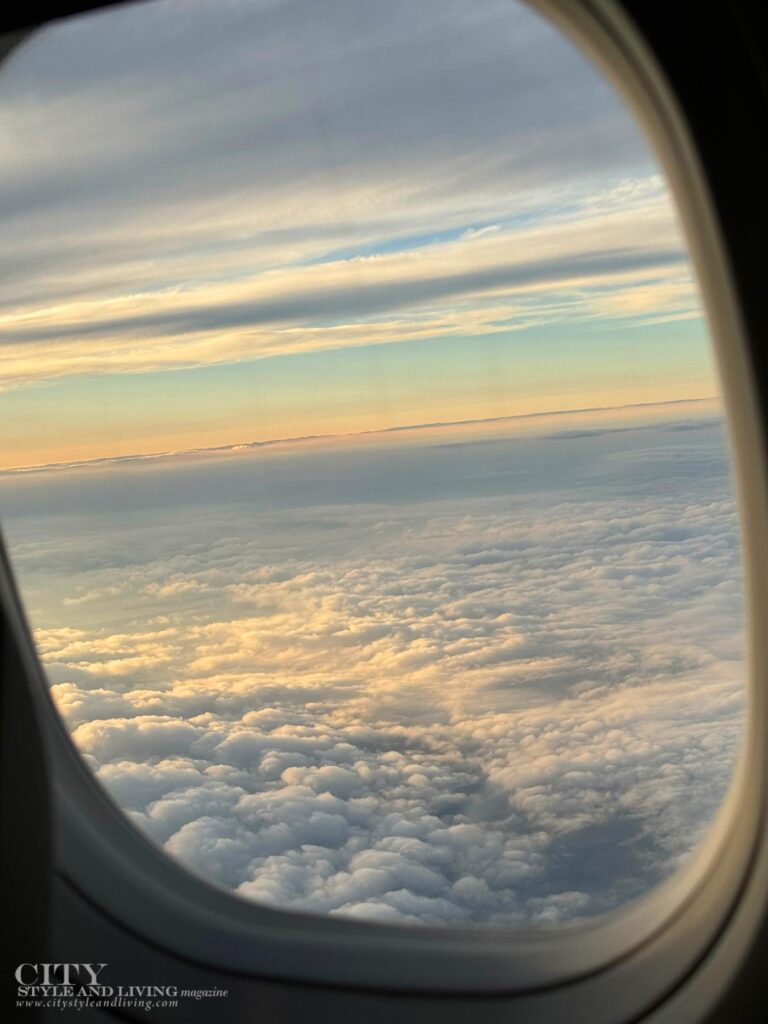 City Style and Living Magazine Winter 2025 Porter Airlines to the Canadian Maritimes sunset and clouds outside passenger window