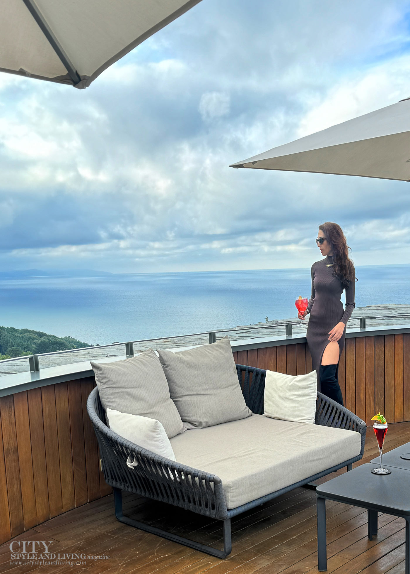 City Style and Living Magazine Spring 2026 Akelarre San Sebastian Spain view to Cantabrian sea deck having cocktails girl in dress