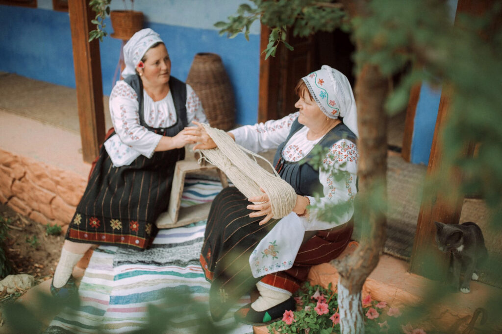 City Style and Living Magazine Summer 2026 Moldova Travel Women talking in traditional wear
